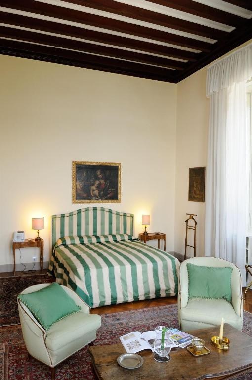 Postel nebo postele na pokoji v ubytování Villa Claudia dei Marchesi Dal Pozzo