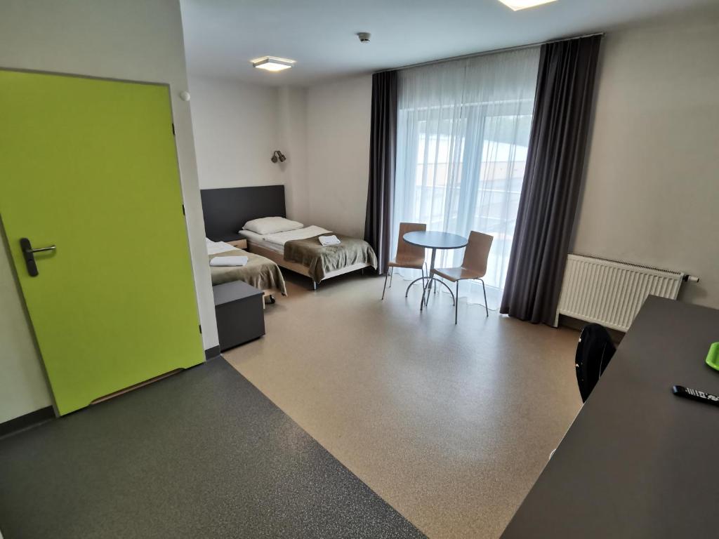Posteľ alebo postele v izbe v ubytovaní WOSiR Drzonków