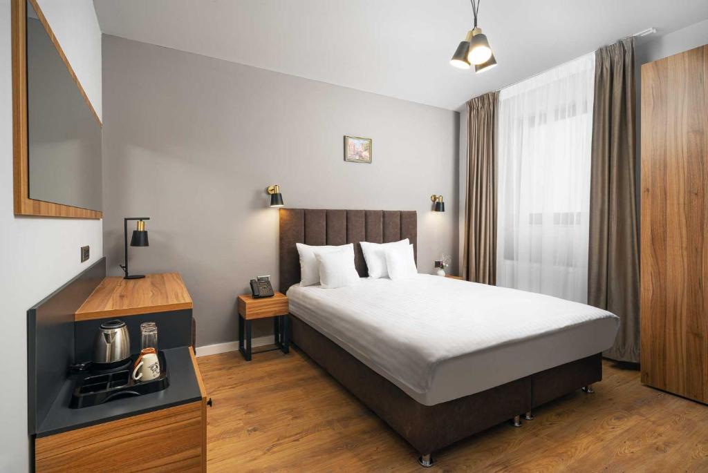 Postel nebo postele na pokoji v ubytování Labirint Boutique Hotel