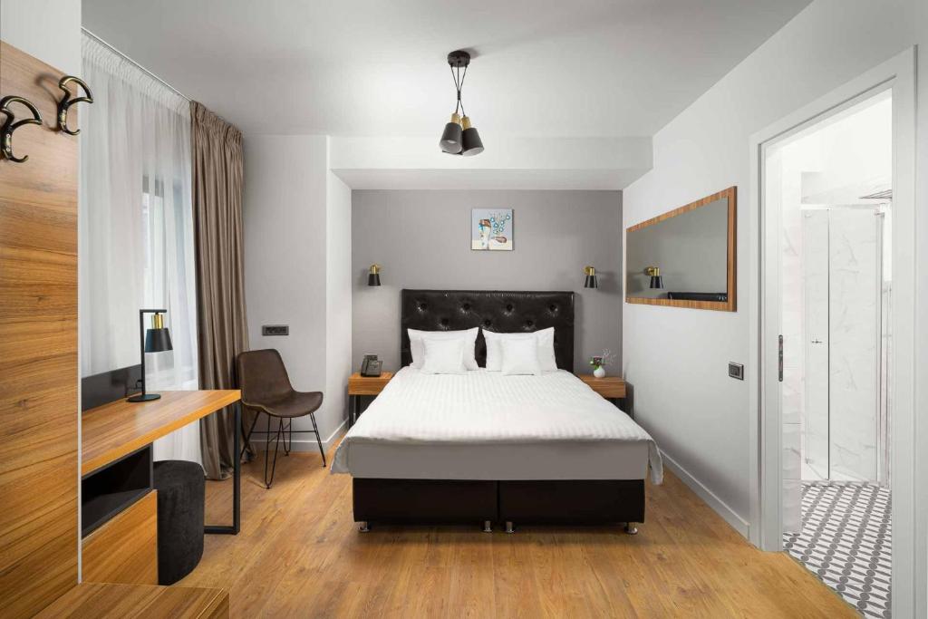 Postel nebo postele na pokoji v ubytování Labirint Boutique Hotel