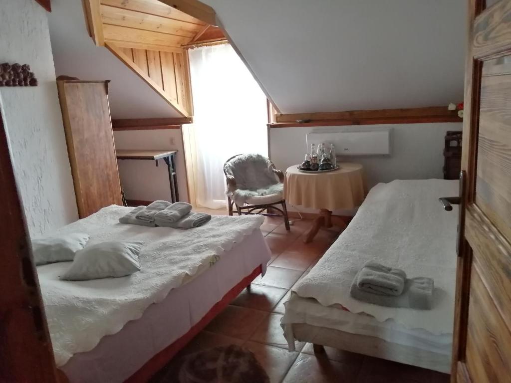 Łóżko lub łóżka w pokoju w obiekcie Galindia