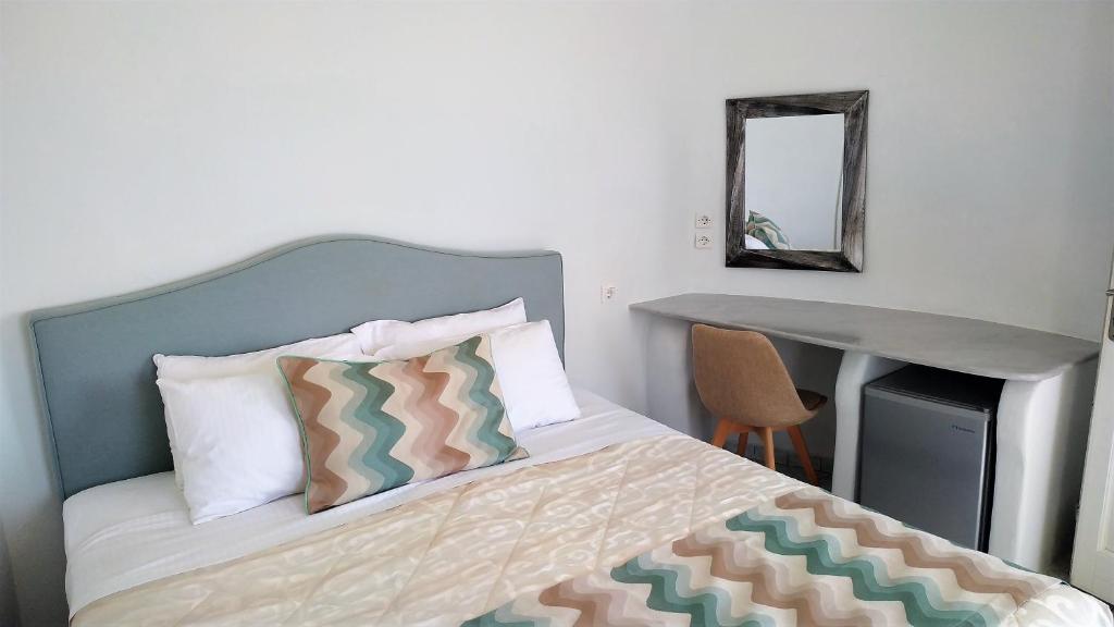 Postel nebo postele na pokoji v ubytování Hotel Mylos