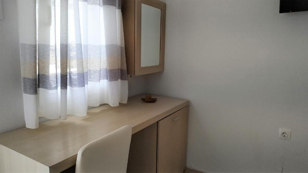 TV a/nebo společenská místnost v ubytování Hotel Mylos