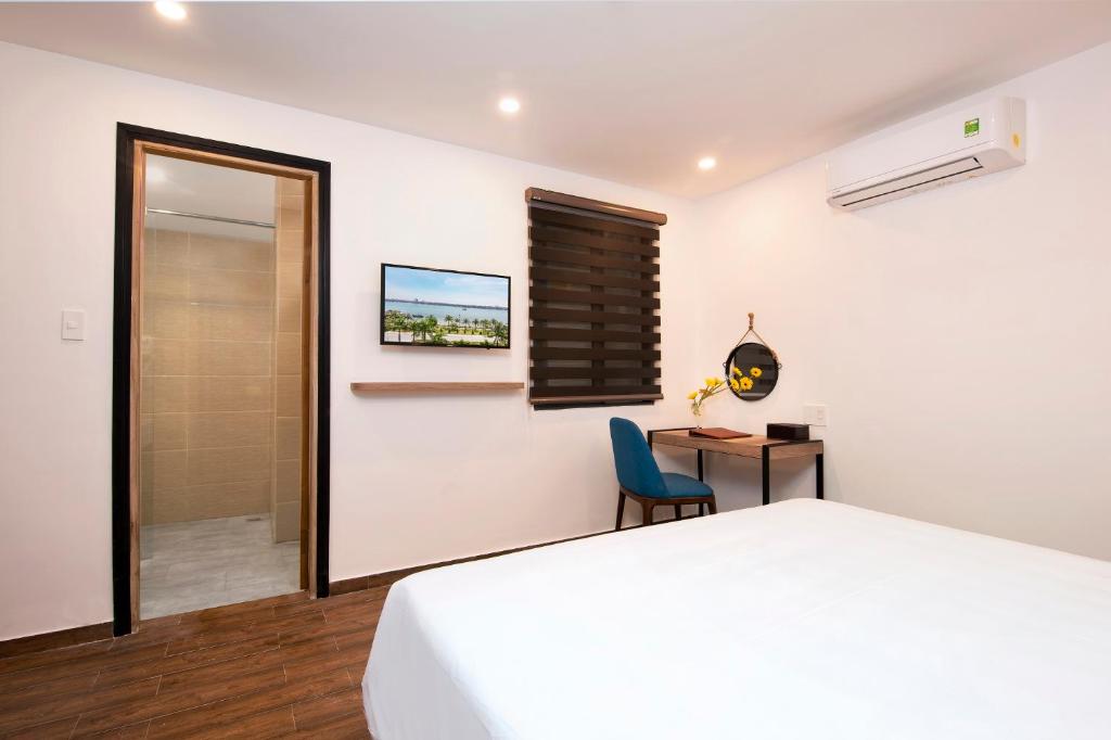 Postel nebo postele na pokoji v ubytování Golden Lotus Central Hotel