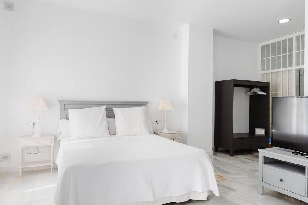 Posteľ alebo postele v izbe v ubytovaní Loft en primera linea del paseo marítimo