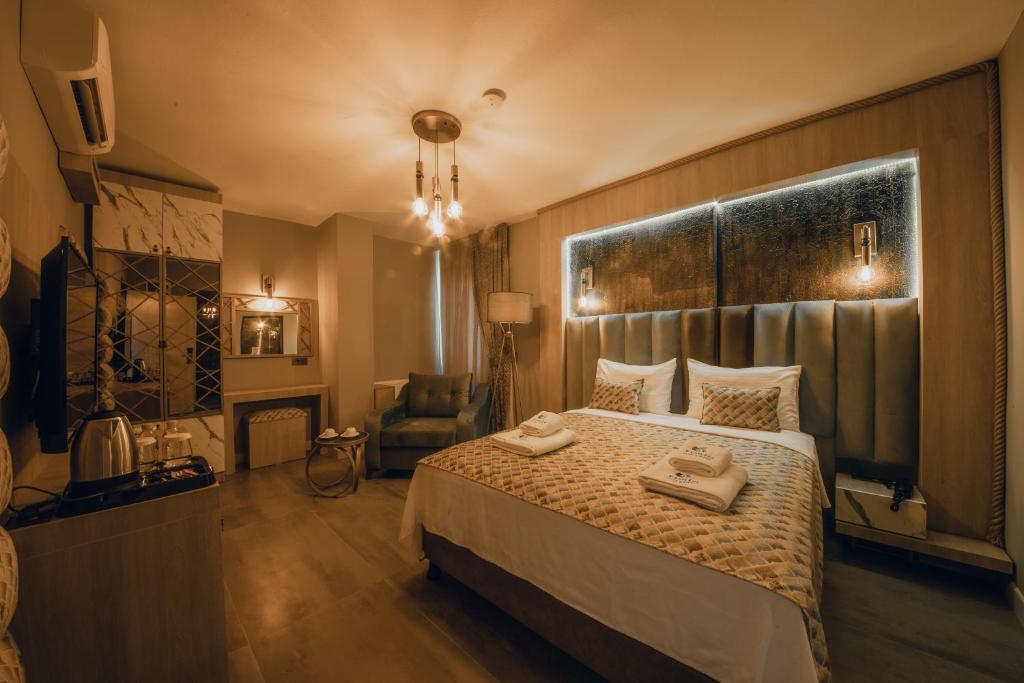Postel nebo postele na pokoji v ubytování Edrin Gözde Hotel
