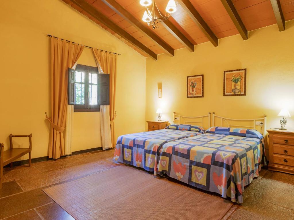 A bed or beds in a room at Belvilla by OYO El Encinar