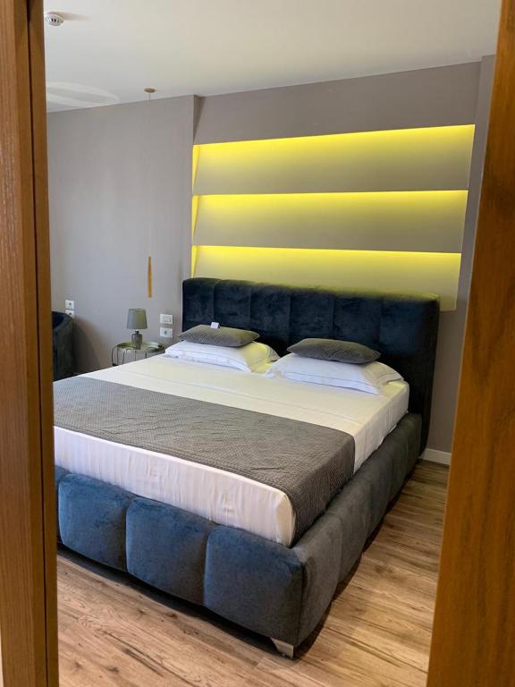 Postel nebo postele na pokoji v ubytování Light Hotel