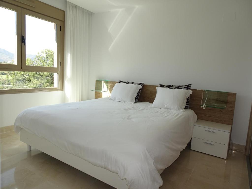 Posteľ alebo postele v izbe v ubytovaní Maison Élégante au Cœur du Golf de la Cala
