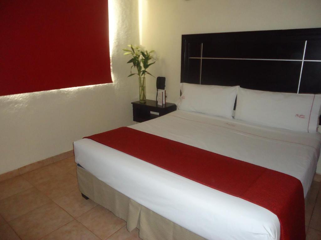 Postel nebo postele na pokoji v ubytování Hotel Estadio