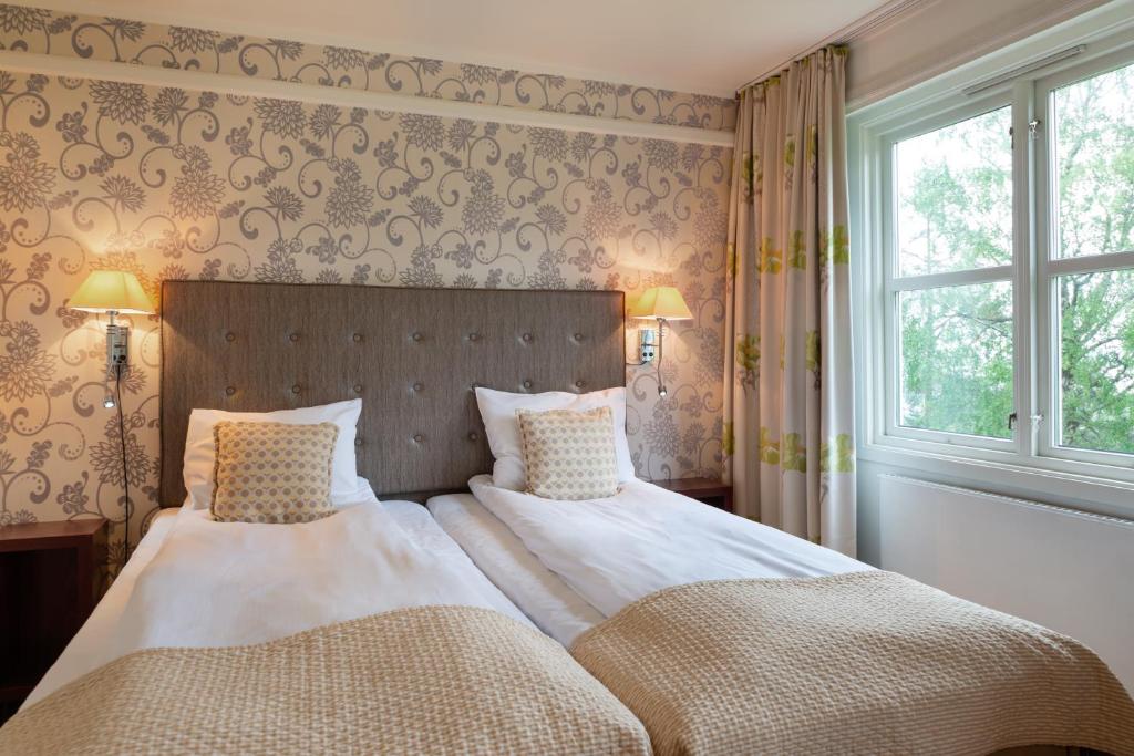 Postel nebo postele na pokoji v ubytování Quality Hotel Leangkollen