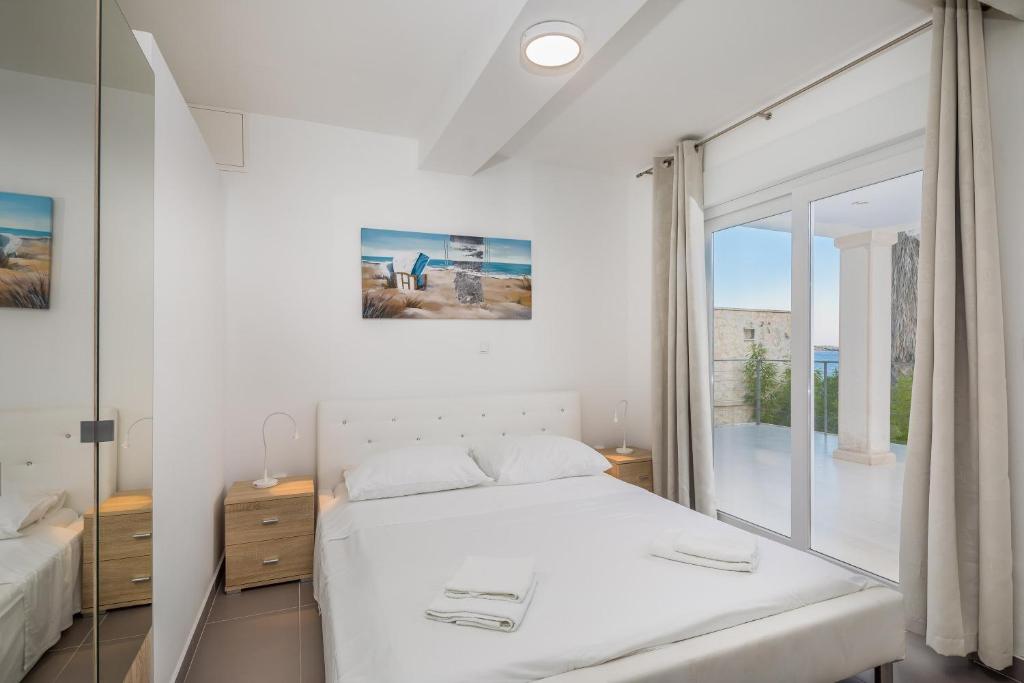 Posteľ alebo postele v izbe v ubytovaní Villa Oceanus