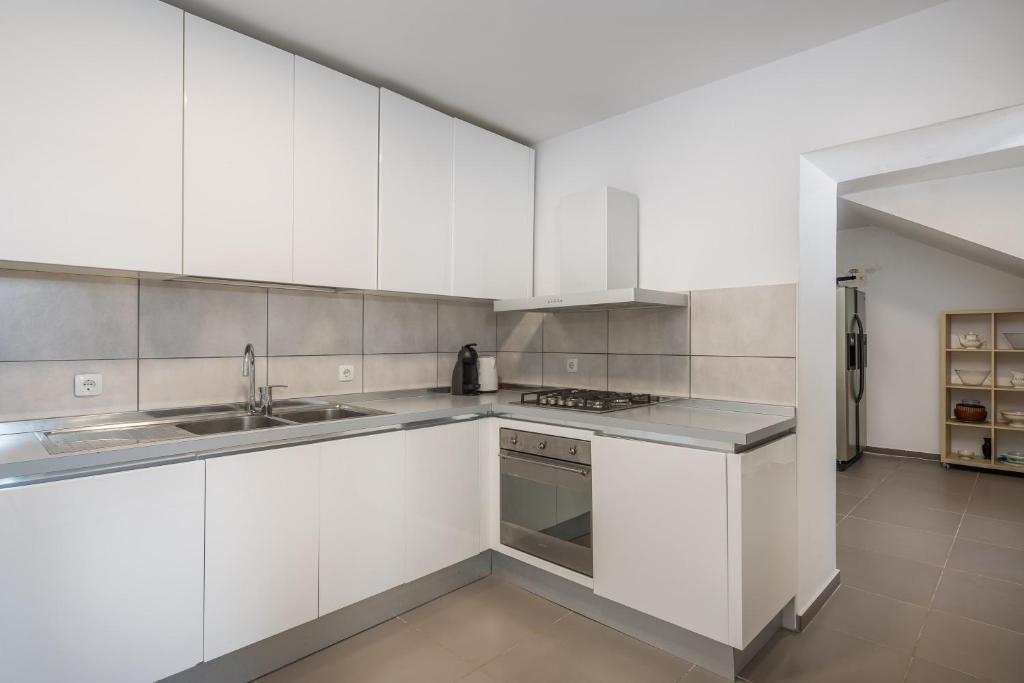 Kuchyňa alebo kuchynka v ubytovaní Villa Oceanus