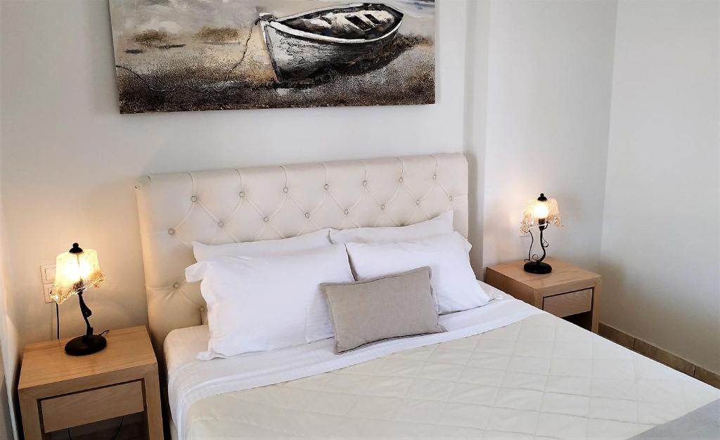 Postel nebo postele na pokoji v ubytování Hotel Mylos