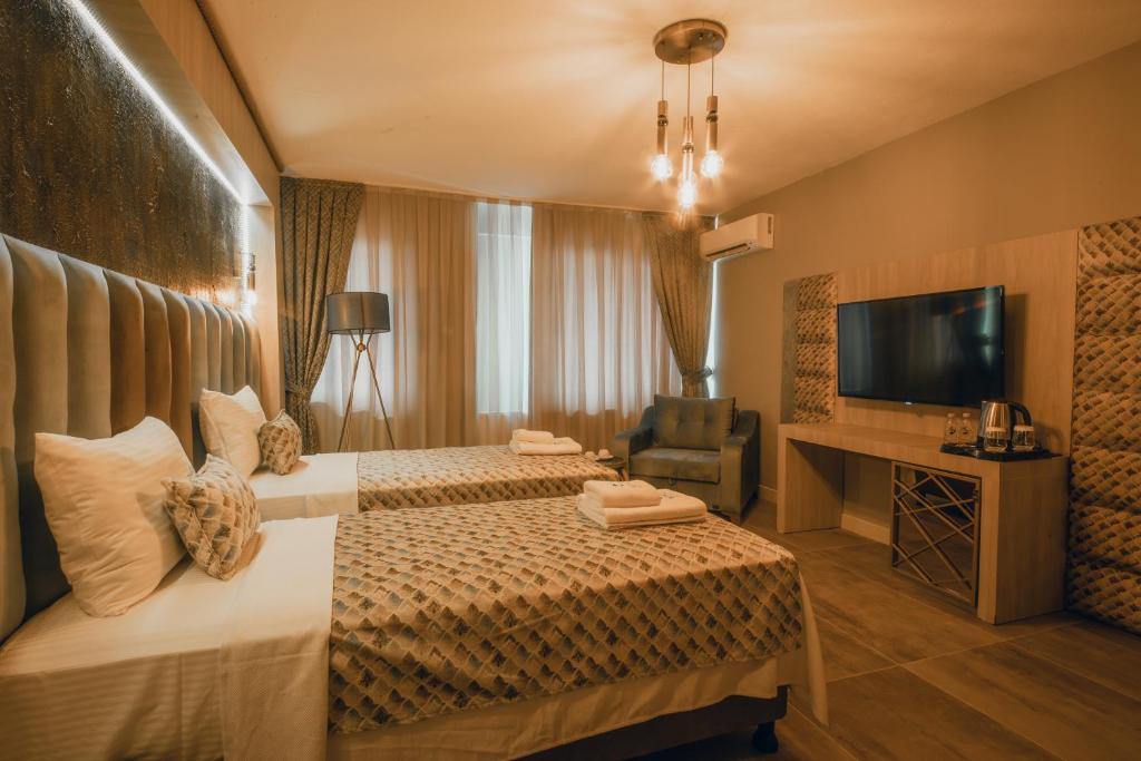 Postel nebo postele na pokoji v ubytování Edrin Gözde Hotel