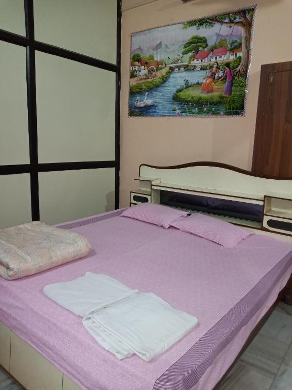 Postel nebo postele na pokoji v ubytování Sunita homestay