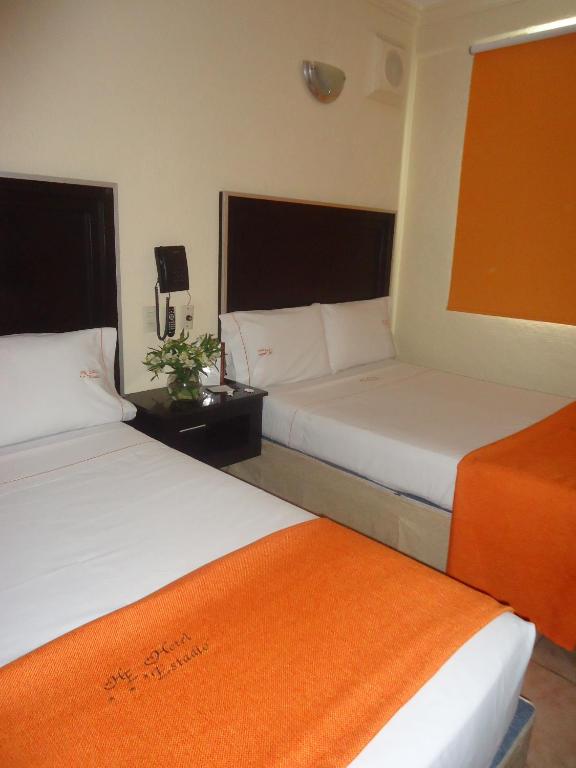Postel nebo postele na pokoji v ubytování Hotel Estadio