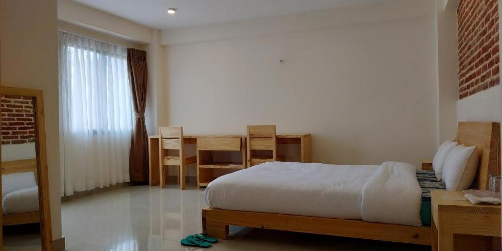 Postel nebo postele na pokoji v ubytování Sayami Home