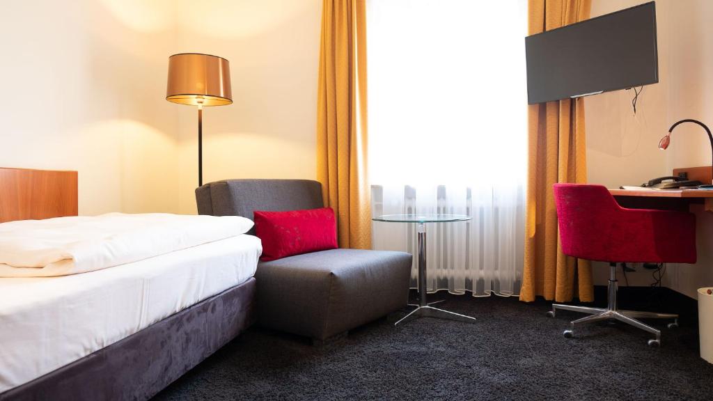 Postel nebo postele na pokoji v ubytování Hotel & Restaurant Walfisch