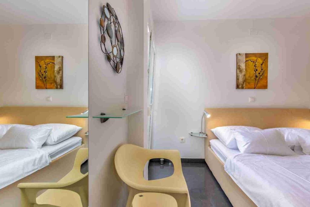 Posteľ alebo postele v izbe v ubytovaní Luxury Apartment Sunflair