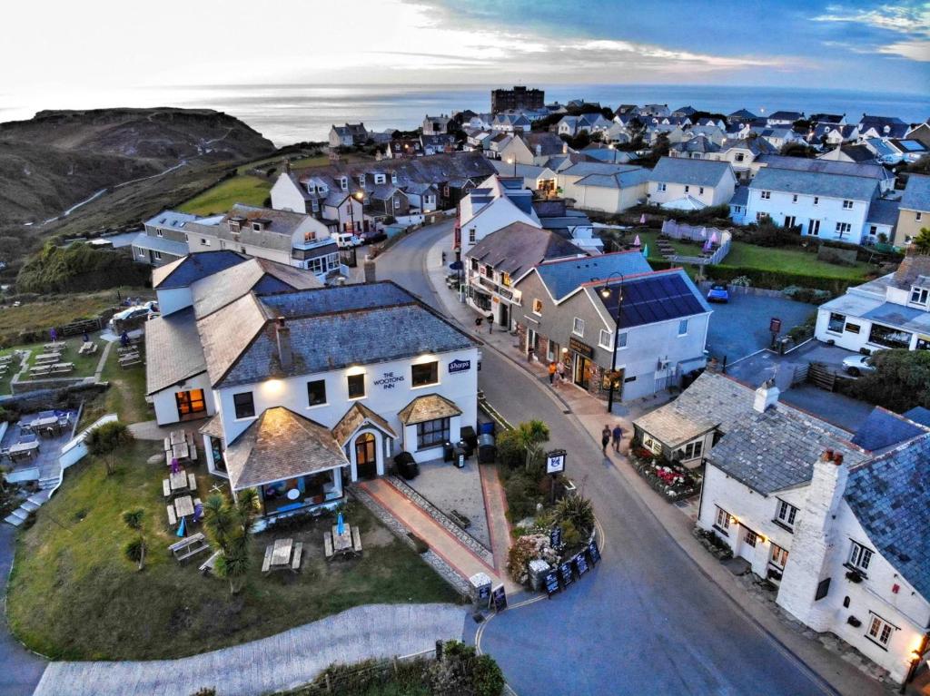 an aerial view of a small town with houses at The Wootons Inn in Tintagel