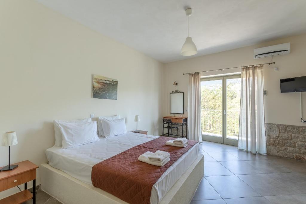 Postel nebo postele na pokoji v ubytování Orion Residence Mani