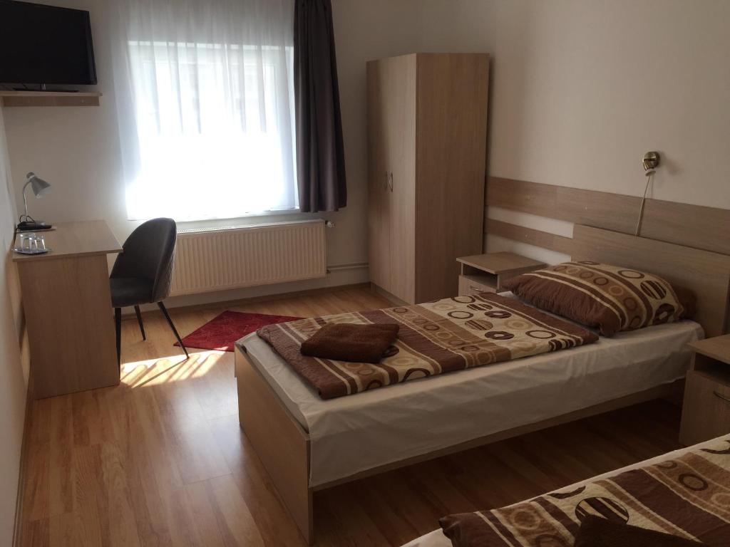 Postel nebo postele na pokoji v ubytování Gerendas Panzió