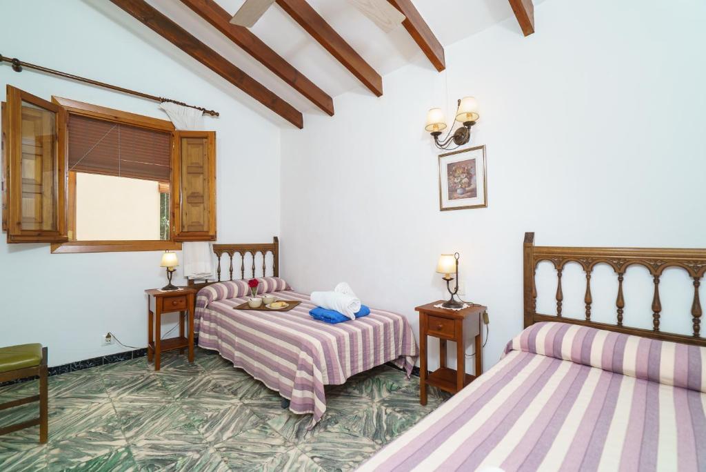 Posteľ alebo postele v izbe v ubytovaní Casa Seniola