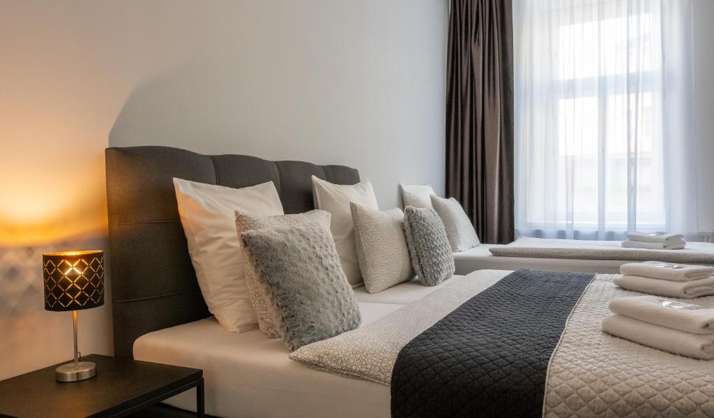 Postel nebo postele na pokoji v ubytování Penzion Apartmány Hradební