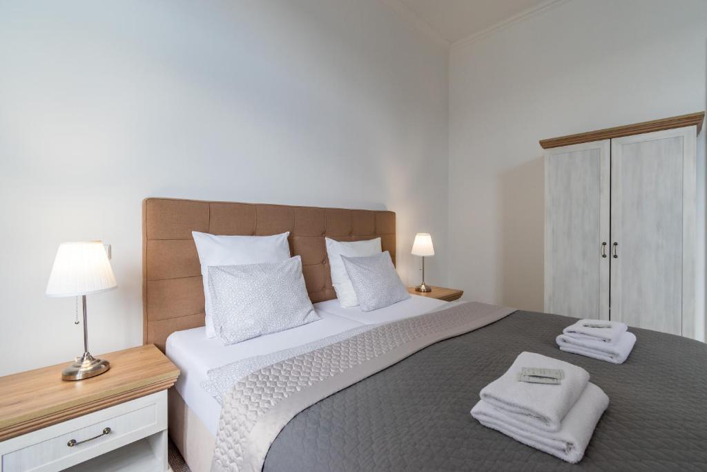 Postel nebo postele na pokoji v ubytování Penzion Apartmány Hradební