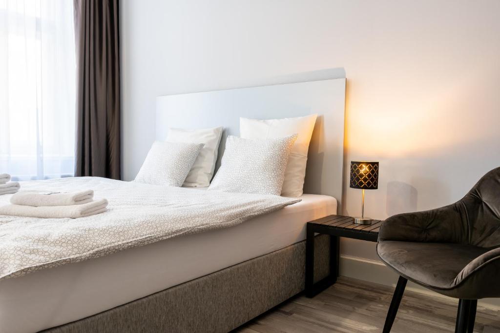 Postel nebo postele na pokoji v ubytování Penzion Apartmány Hradební