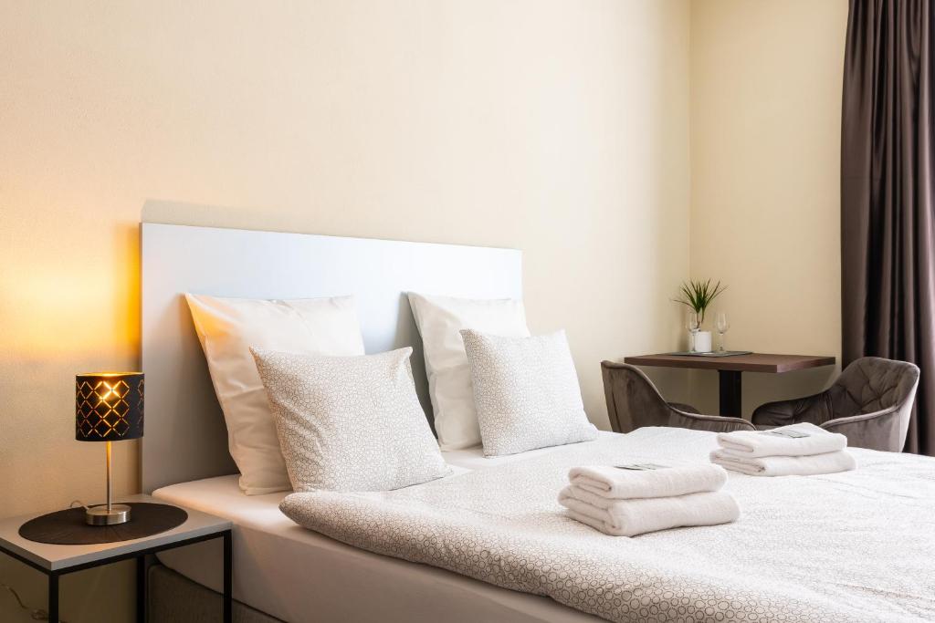 Postel nebo postele na pokoji v ubytování Penzion Apartmány Hradební