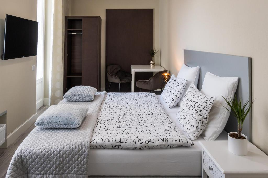 Postel nebo postele na pokoji v ubytování Penzion Apartmány Hradební