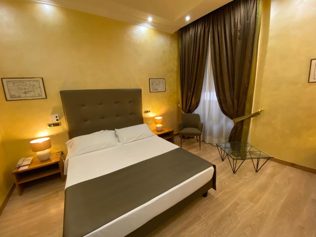 Postel nebo postele na pokoji v ubytování Hotel Cicolella