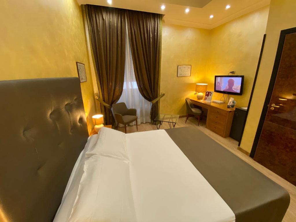 Postel nebo postele na pokoji v ubytování Hotel Cicolella