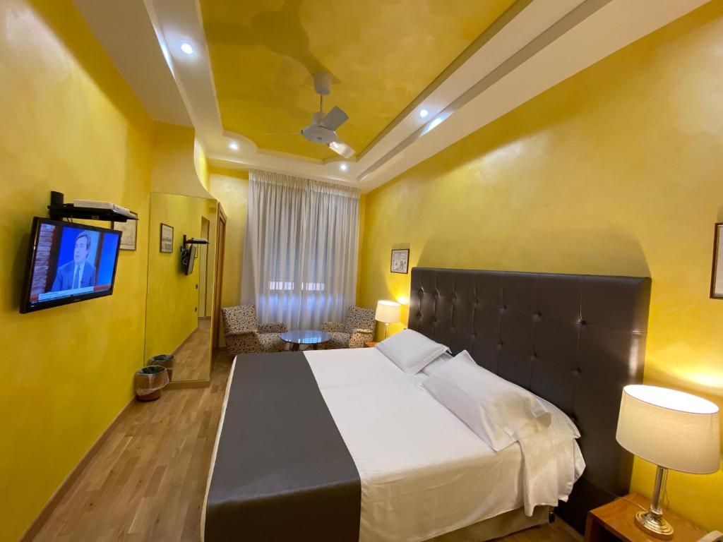 Postel nebo postele na pokoji v ubytování Hotel Cicolella