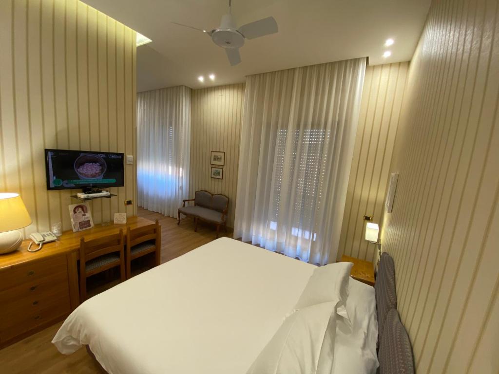 TV a/nebo společenská místnost v ubytování Hotel Cicolella