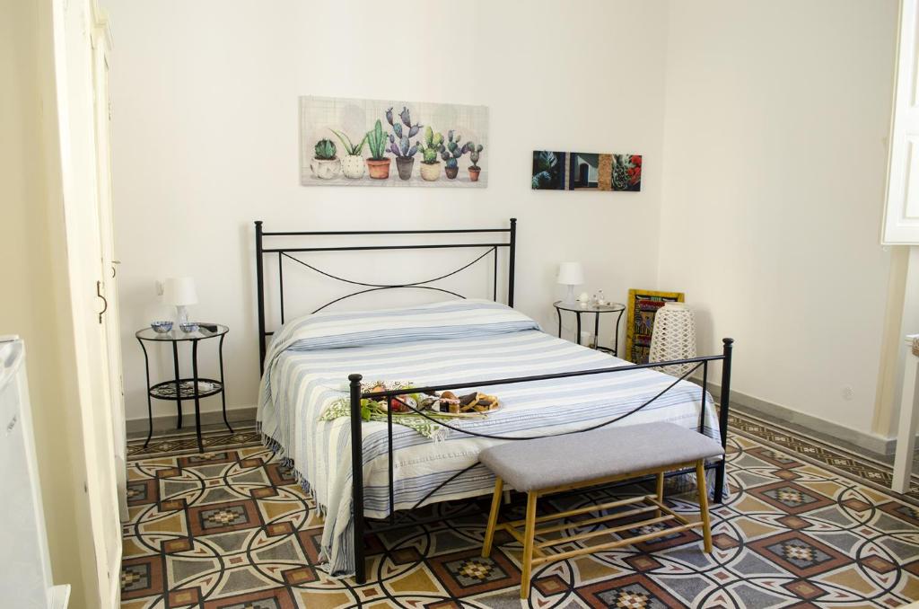 Postel nebo postele na pokoji v ubytování Ingrosso House