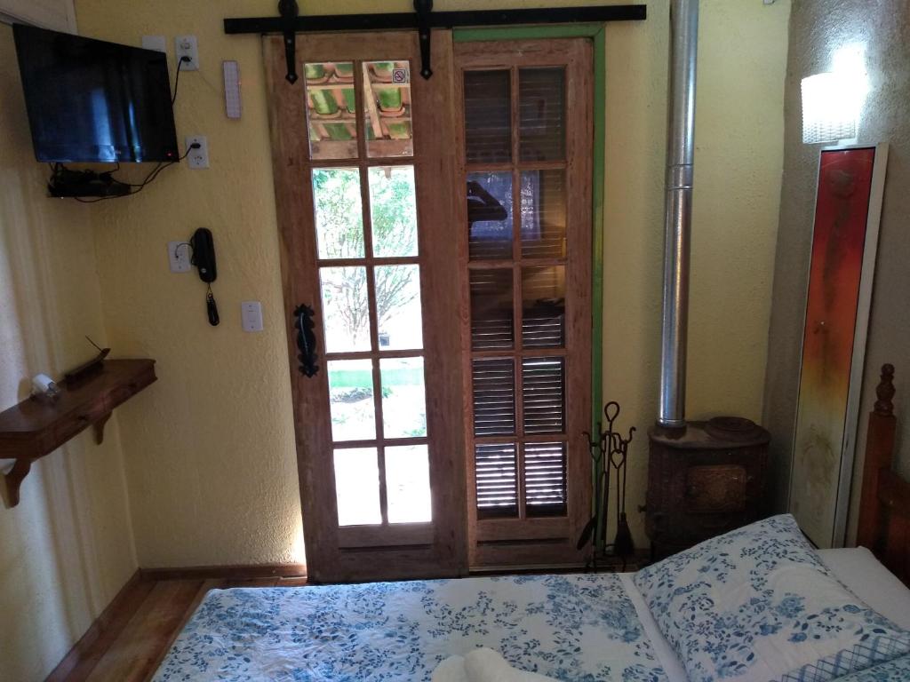Cama ou camas em um quarto em Pousada Janela do Céu