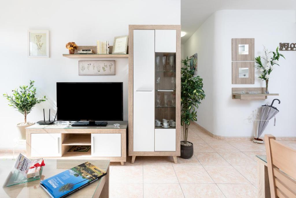 TV a/nebo společenská místnost v ubytování Vivienda Vacacional La Laguna Deluxe 6