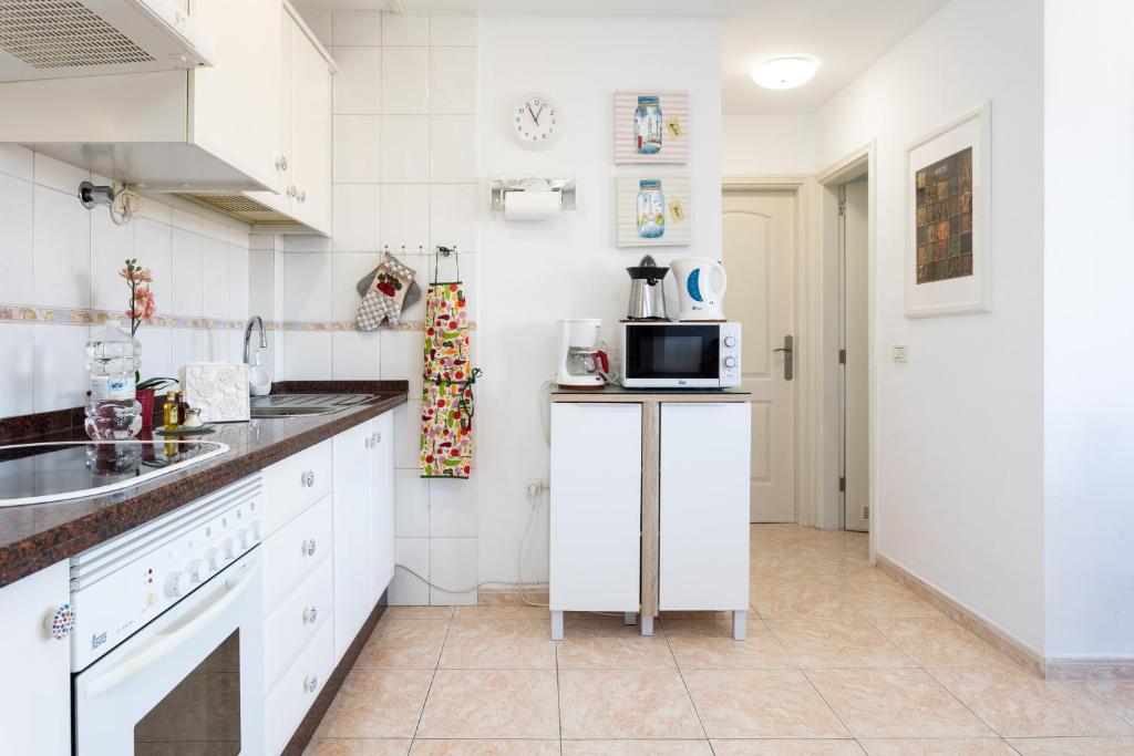 Kuchyň nebo kuchyňský kout v ubytování Vivienda vacacional La Laguna Deluxe 9