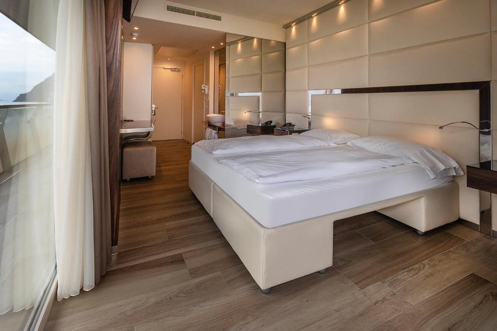 Posteľ alebo postele v izbe v ubytovaní Hotel Ideal
