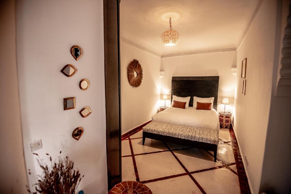 Ein Bett oder Betten in einem Zimmer der Unterkunft Riad Palais Calipau