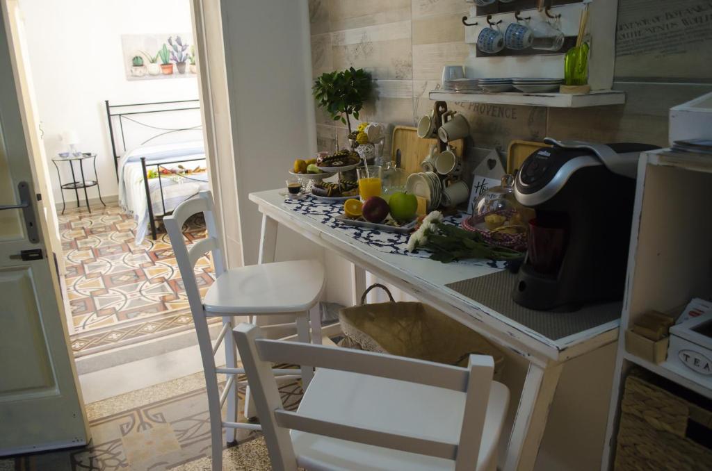 Kuchyň nebo kuchyňský kout v ubytování Ingrosso House