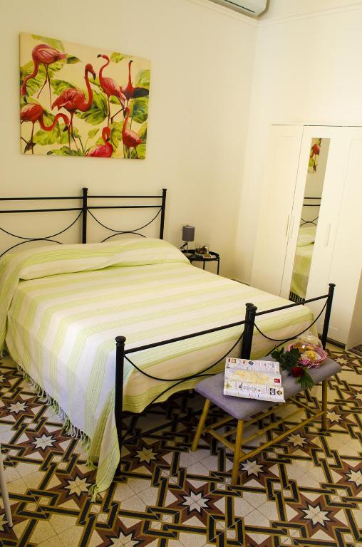 Postel nebo postele na pokoji v ubytování Ingrosso House