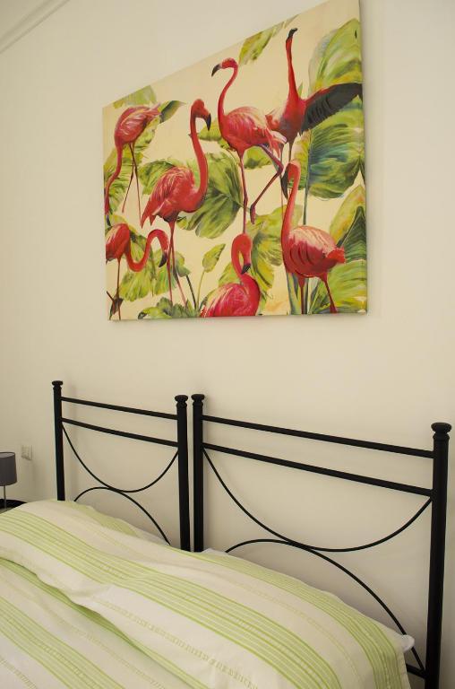 Postel nebo postele na pokoji v ubytování Ingrosso House