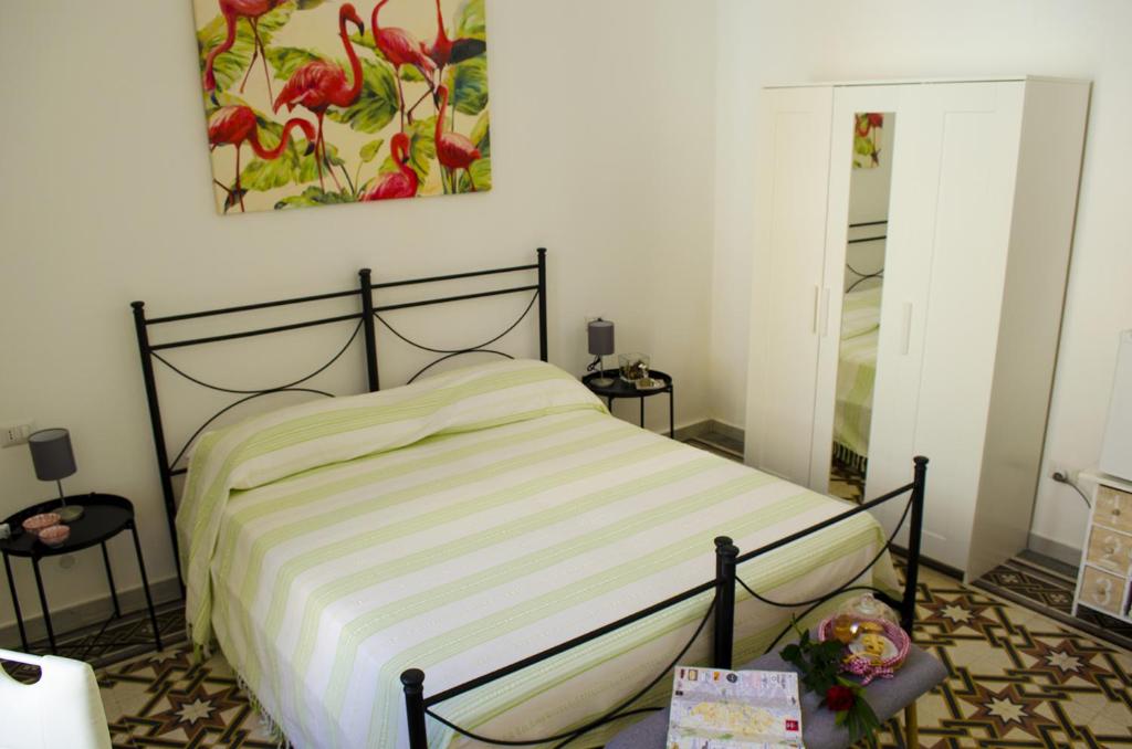 Postel nebo postele na pokoji v ubytování Ingrosso House