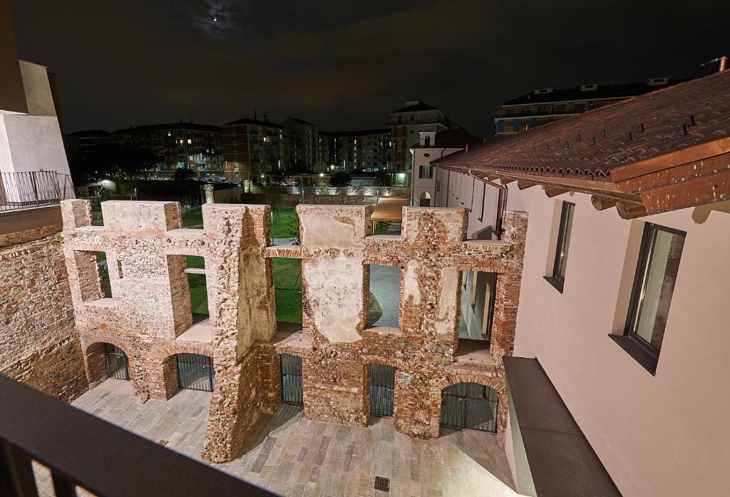 an aerial view of a building at night at Hotel Cascina Fossata & Residence in Turin