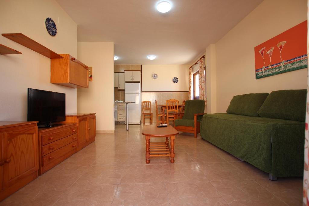 TV a/nebo společenská místnost v ubytování Apartamentos Tesy