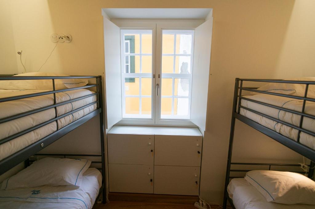 Postel nebo postele na pokoji v ubytování Change The World Hostels - Coimbra - Almedina